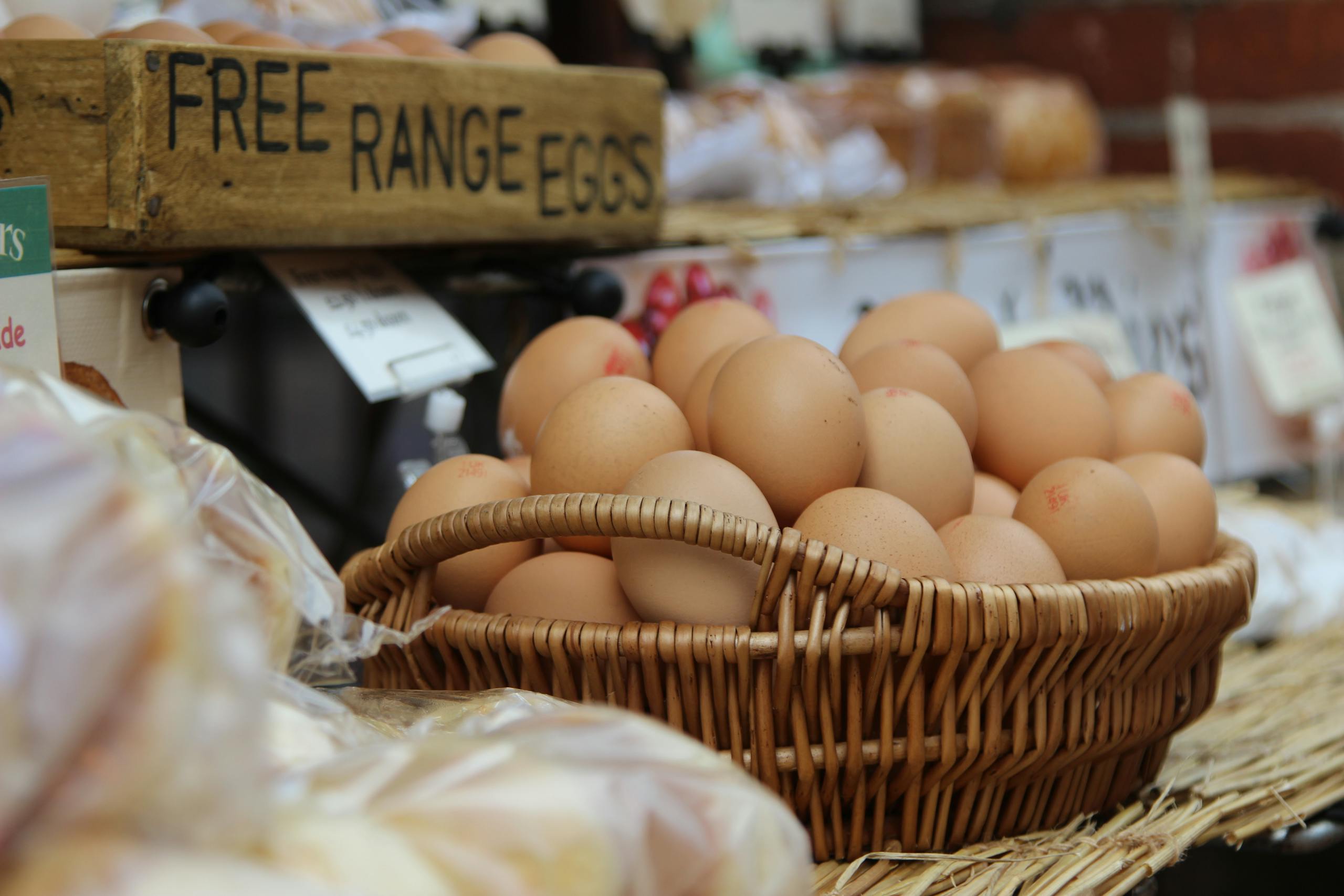What to do with surplus eggs from your chickens. A basket of brown free range eggs displayed at a market.